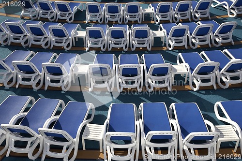 Image of empty sun loungers