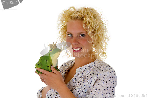 Image of Young woman kissing a frog prince