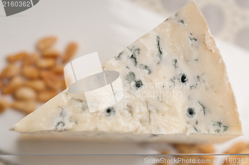 Image of gorgonzola cheese fresh cut and pinenuts