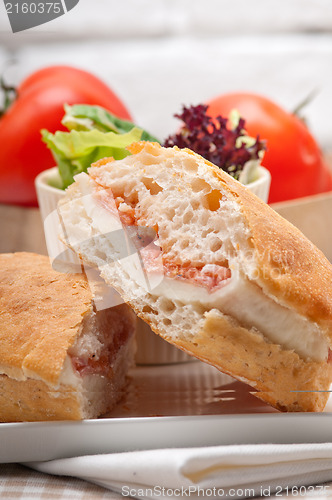 Image of ciabatta panini sandwich with parma ham and tomato