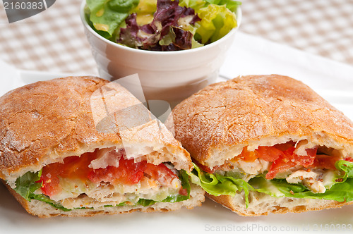 Image of ciabatta panini sandwich with chicken and tomato