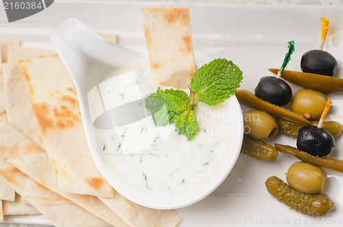 Image of Greek Tzatziki yogurt dip and pita bread