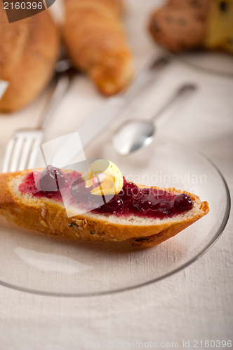 Image of bread butter and jam 