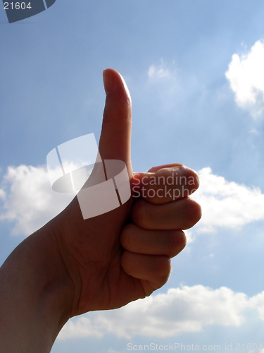 Image of Thumbs up with cloud background