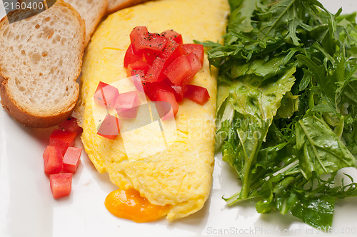 Image of cheese ometette with tomato and salad