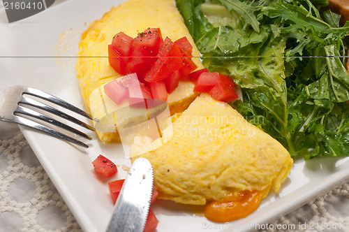 Image of cheese ometette with tomato and salad