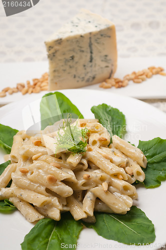 Image of Italian pasta penne gorgonzola and pine nuts