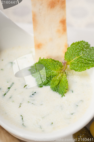 Image of Greek Tzatziki yogurt dip and pita bread