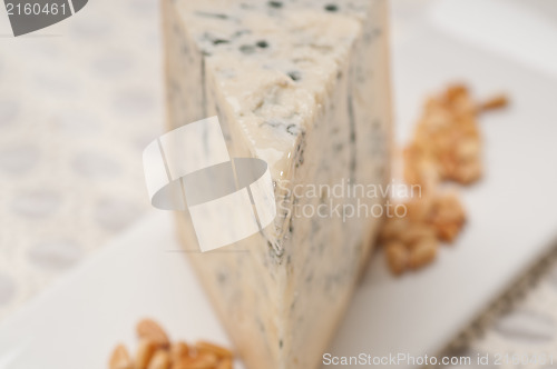 Image of gorgonzola cheese fresh cut and pinenuts
