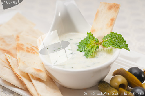 Image of Greek Tzatziki yogurt dip and pita bread