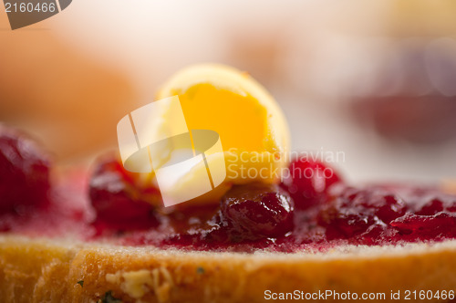Image of bread butter and jam 