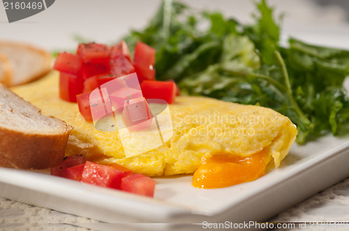 Image of cheese ometette with tomato and salad