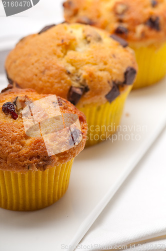 Image of fresh chocolate and raisins muffins