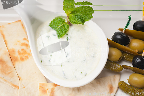 Image of Greek Tzatziki yogurt dip and pita bread