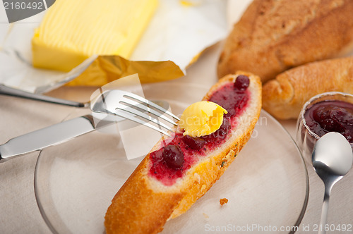 Image of bread butter and jam 