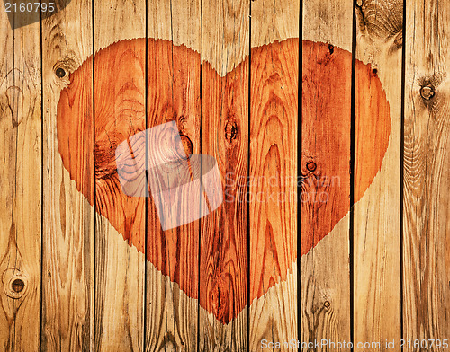 Image of Silhouette of heart on wooden wall