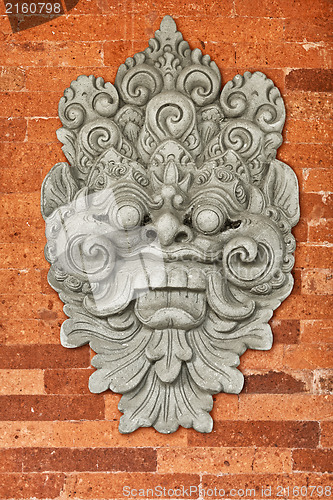 Image of Stone bas-relief on the brick wall. Indonesia, Bali.