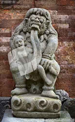 Image of Antique statue of child-eating Rangda. Indonesia, Bali.