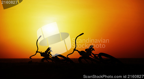 Image of Concept of romance and love - pair vintage bicycles at sunset