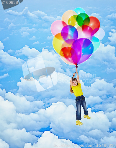 Image of Cheerful girl flies with balloons