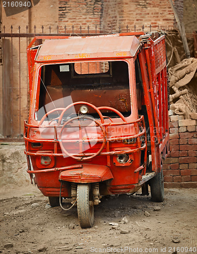 Image of Grunge small red cargo car