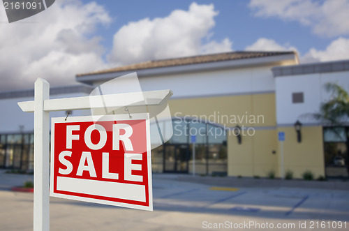 Image of Vacant Retail Building with For Sale Real Estate Sign