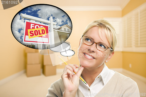 Image of Woman in Empty Room with Thought Bubble of Sold Real Estate Sign