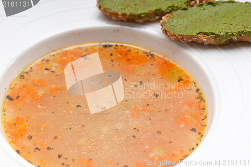 Image of Italian minestrone soup with pesto crostini on side