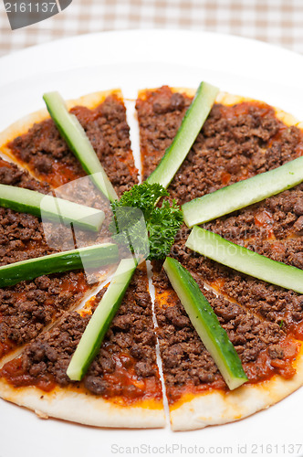 Image of Turkish beef pizza with cucumber on top