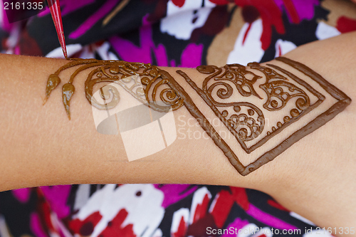 Image of Henna art on woman's hand