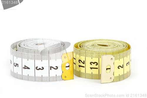 Image of Yellow and white measuring tape isolated on white