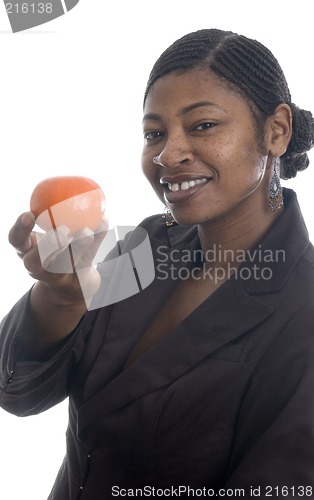 Image of woman holding tangerine