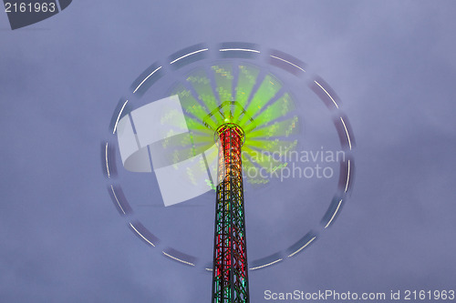 Image of Danger carousel - big wheel in motion at night