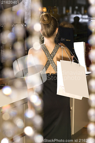 Image of back of lady in the boutique