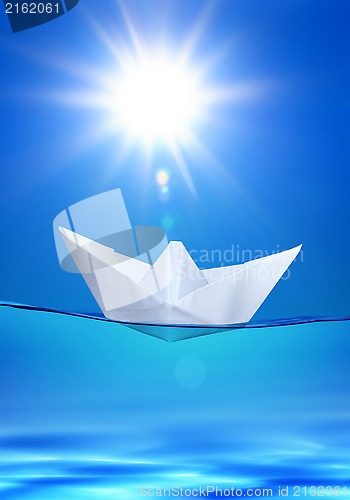 Image of paper toy-ship under sun