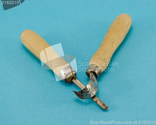 Image of pair chisel graver carve tools on blue 