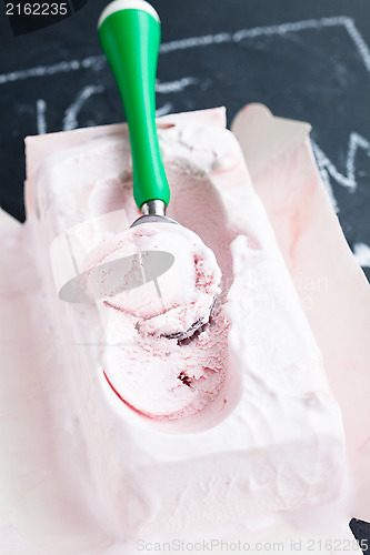 Image of Strawberry ice cream and scoop