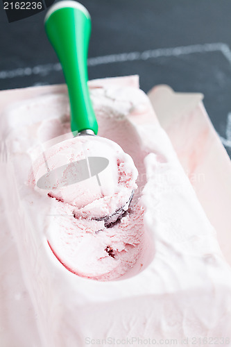 Image of Strawberry ice cream and scoop