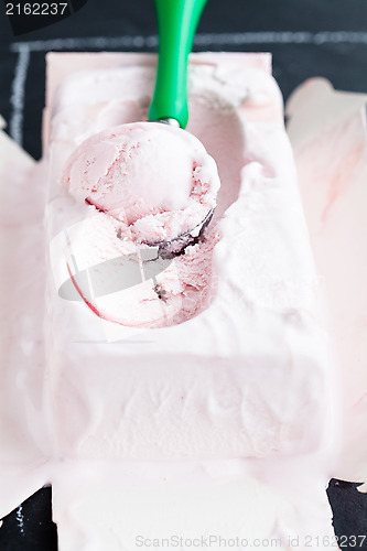 Image of Strawberry ice cream and scoop