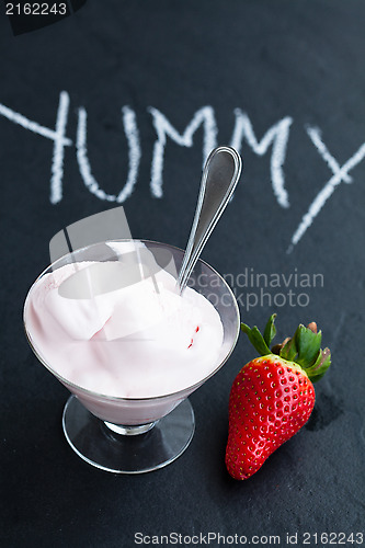 Image of Strawberry ice cream in glass bowl