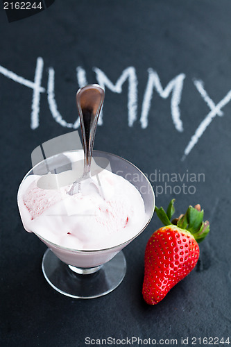 Image of Strawberry ice cream in glass bowl