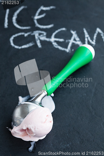 Image of Strawberry ice cream and scoop