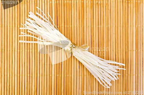 Image of Noodles rice on a bamboo napkin