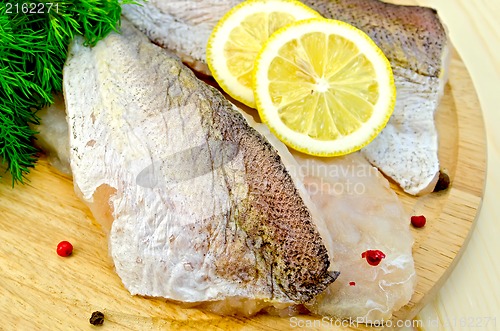 Image of Fillet of codfish on a round board