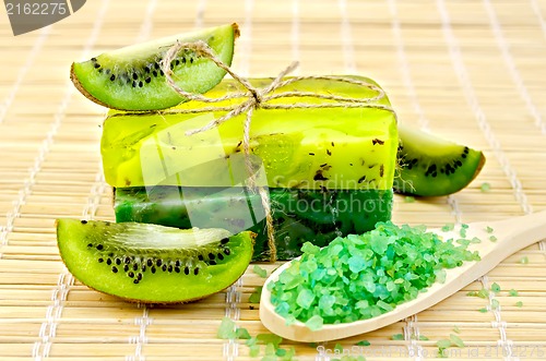 Image of Soap homemade and salt in a spoon with kiwi