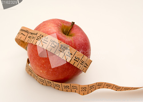 Image of Red apple with measuring tape