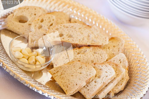 Image of Tray of Fresh Made Sourdough Bread with Garlic Cloves