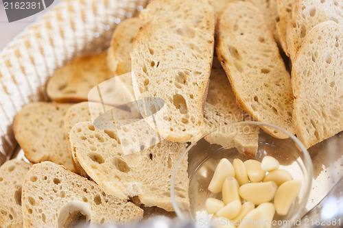 Image of Tray of Fresh Made Sourdough Bread with Garlic Cloves