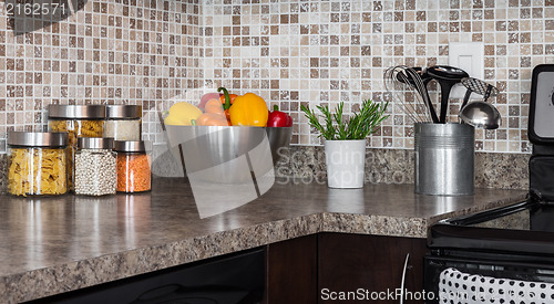 Image of Food ingredients and herbs on kitchen countertop 