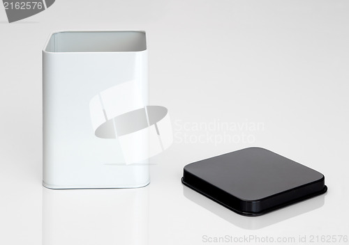 Image of Open metal container on white background